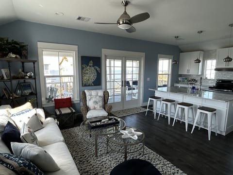 Relax at the counter or in the seating area across from open kitchen.