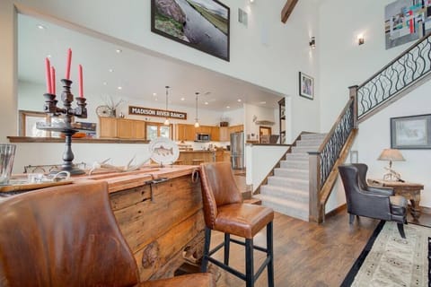 The living area is open to the kitchen and offers multiple seating areas.