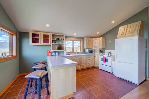 The well stocked kitchen offers a full-size refrigerator, stove, microwave and Keurig coffee maker.