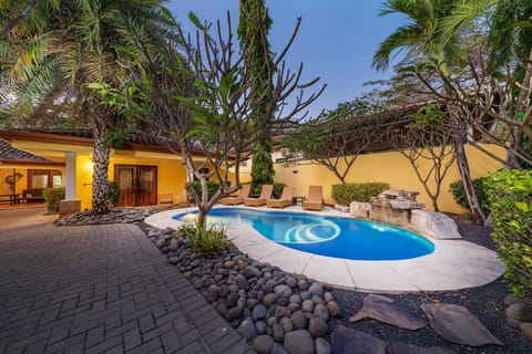 View of the pool as guests walk through the main gate.