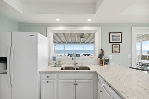 Kitchen with a large window to enjoy ocean views while you're cooking.