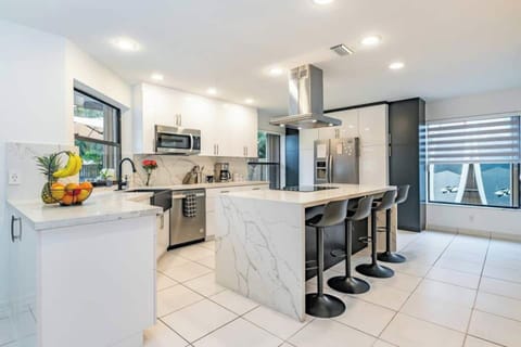 Fully equipped chef kitchen in Fox Island's open space, new appliances and culinary bliss