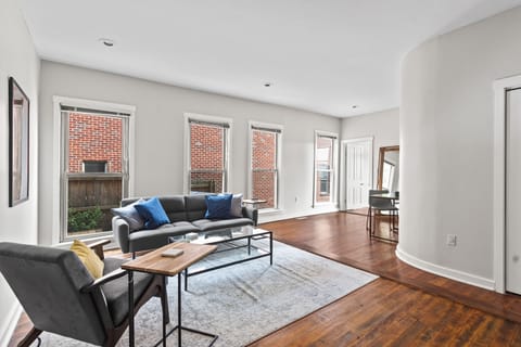 Bright, open living space including smart TV and futon