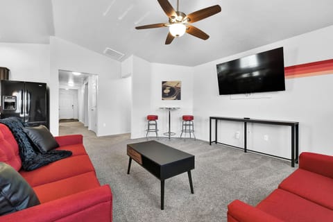 Red Room with Smart TV and Front Hallway
