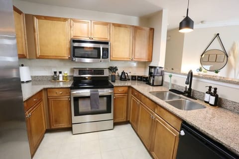 Cook with ease in our fully equipped kitchen, featuring stainless steel appliances, granite countertops, and all the essentials—including a coffee maker to jumpstart your mornings.