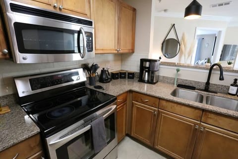 A fully equipped kitchen ready for your culinary creations. From the stainless steel appliances to the dedicated coffee station, we’ve provided everything you need to feel right at home.