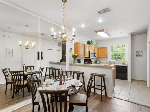 Spacious dining area with seating for six and open kitchen access—ideal for shared meals and conversation.