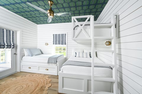 Kids room has plenty of space and a balcony to look out to the water.