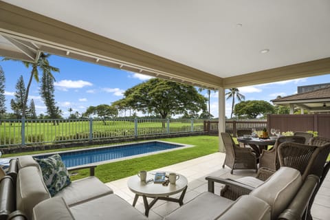 Covered lanai overlooking the private pool and Kona Country Club golf course greens.