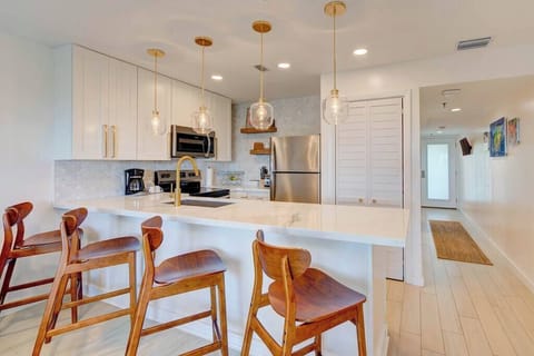 Marble counters, teak barstools and local artwork are among the high quality finishings throughout.