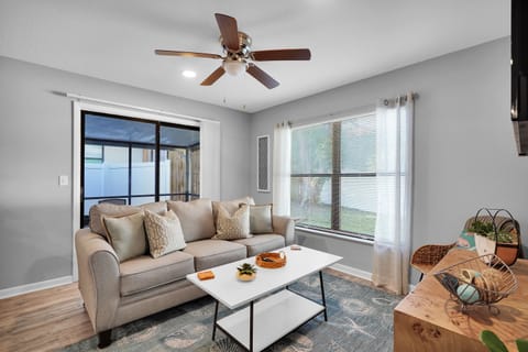 Modern, open-concept living space with a minimalist decoration style