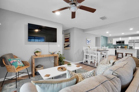 Modern, open-concept living space with a minimalist decoration style