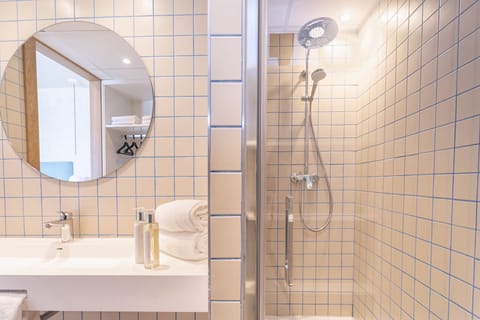 Shower, eco-friendly toiletries, hair dryer, towels