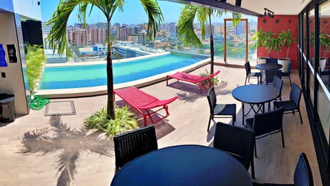 Indoor pool, pool umbrellas, sun loungers