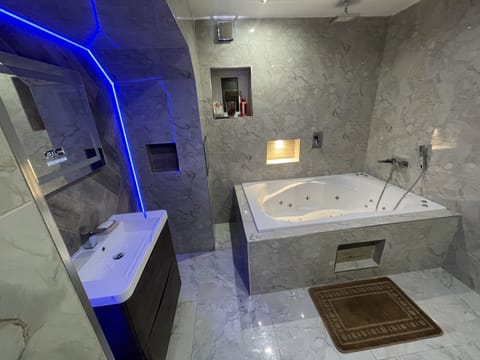 Apartment | Bathroom | Combined shower/tub, deep soaking tub, towels, toilet paper