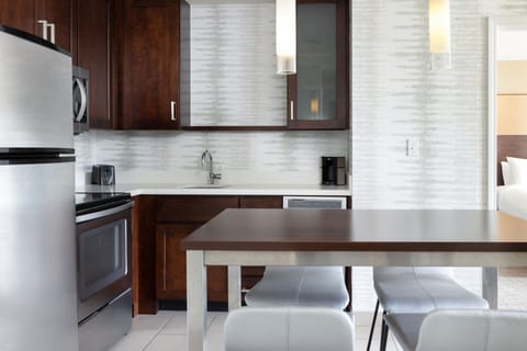 Suite, Multiple Beds | Private kitchen | Fridge, microwave, stovetop, dishwasher