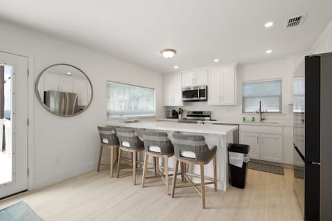 2nd Floor Fully Stocked Kitchen Area provides extra seating for up to 4 guests