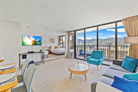 Living room with window AC. Cable TV