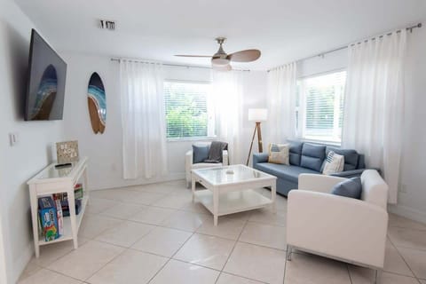 Enjoy movies in our welcoming living room with your crew on our 65" HD Smart TV. Spread out with our pullout sofa and Queen size air mattress #livingroomgoals #interiordesign #homedecor ️