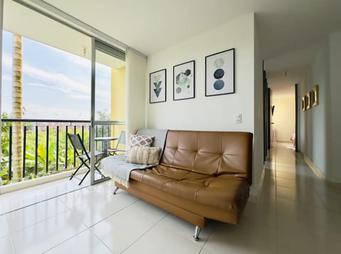 Living room with balcony view to natural landscape