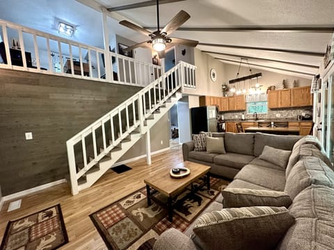 Vaulted ceiling great room overlooking the game room loft
