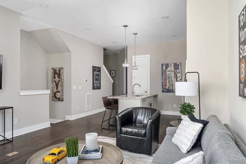 The stairs to the lower level and garage access are just off of the kitchen!