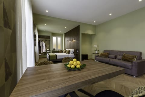 Family Quadruple Room | Living area | 45-inch Smart TV with satellite channels, TV