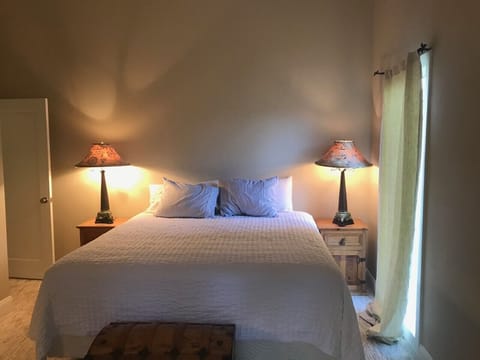 Primary Bedroom 1 with King Bed, walk in Closet and ensuite full Bath & Balcony
