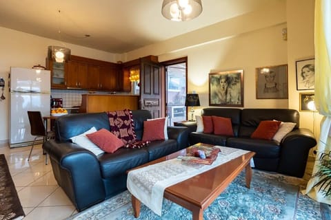 Relax in the inviting living room area, where comfort meets style - Inviting living room area, where comfort meets style