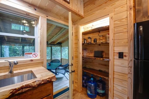 You can easily access the screened-in patio from the kitchen.