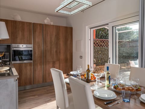 Furniture, Table, Window, Tableware, Wood, Bottle, Building, Lighting, Cabinetry, Architecture