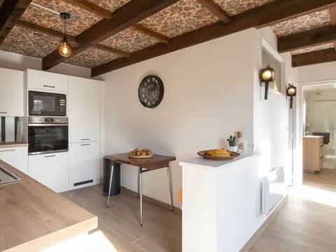 Furniture, Interior Design, Flooring, Kitchen, Wall, Countertop, Floor, Wood, Ceiling, Cabinetry