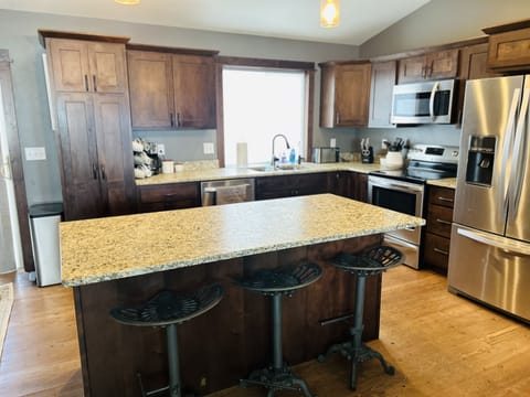 Kitchen and island for extra seating.