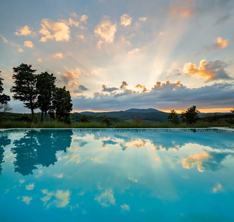 Seasonal outdoor pool, open 8:30 AM to 7:30 PM, pool umbrellas