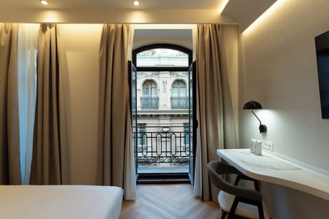 Standard Double Room | Minibar, in-room safe, desk, blackout drapes
