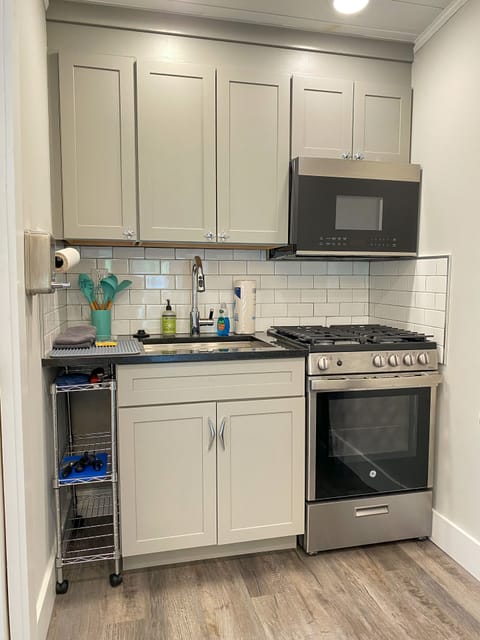 Full kitchen with Gas Stove, full size microwave & the Essentials 