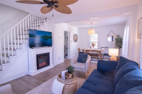 The chic bohemian styled living room features a large comfy couch.