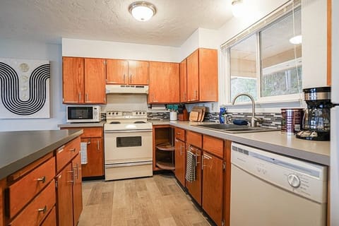 The fully equipped kitchen has everything you need to whip up delicious meals, from cookware to utensils, and more. Whether you're a seasoned chef or just starting out, you'll feel right at home here. 