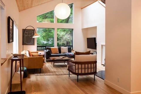 Wonderfully remodeled living room with all new hardwood floors and beautiful lighting throughout.