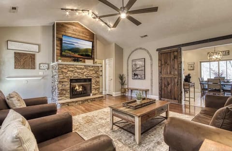 Gather around the stone fireplace and enjoy stunning mountain views on the big screen!
