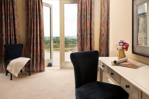 Shepherd's House - bedroom one with doors leading directly onto the rear patio offering stunning views of the surrounding countryside
