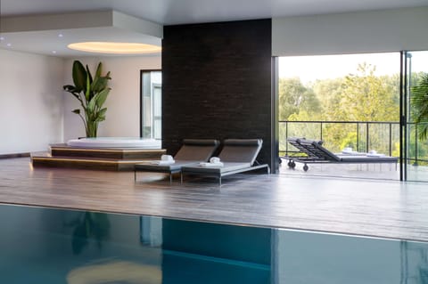 Indoor pool, open 1:00 PM to 9:00 PM, sun loungers