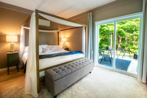Experience ultimate luxury in our primary bedroom, complete with a grand king-sized canopy bed with memory foam mattress and a soft duvet cover.