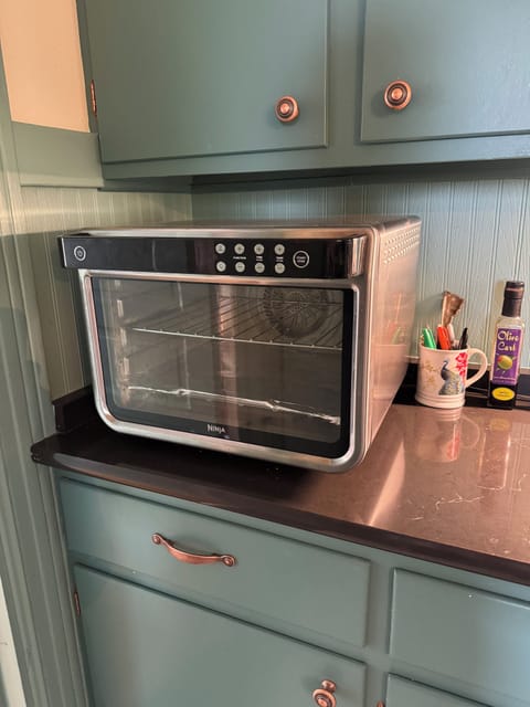 A toaster oven replaces the traditional oven. Bakes, broils, air fries, toasts.