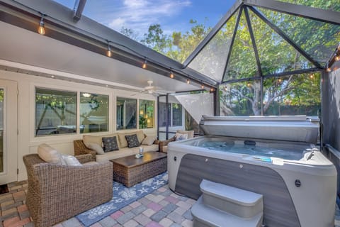 Enjoy outside dining and relaxing in the 5-person hot tub in a screened in lanai