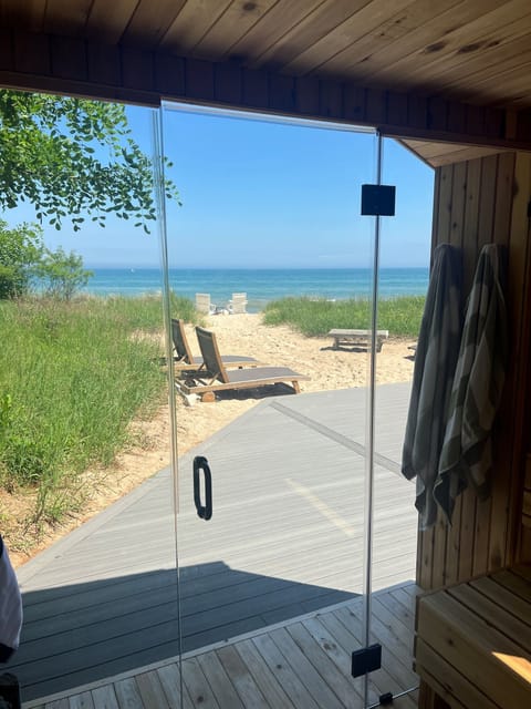 A brand new 6-person custom sauna added in 2025 provides spectacular views of Lake Michigan.