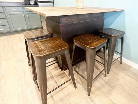 Come enjoy a meal with your favorite people at this cozy table, accommodating up to 4 guests!