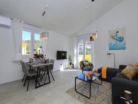 Apartment (One Bedroom Apartment with Balcony) | Living room | 25-inch flat-screen TV with satellite channels, TV