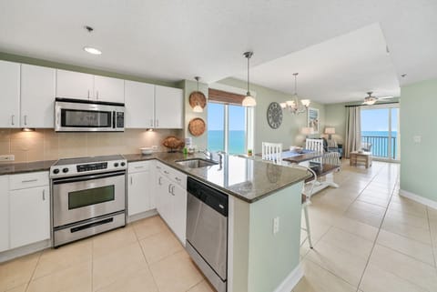 Cook your favorite meals in this bright, modern kitchen while ocean breezes drift through your windows and stunning sea views inspire.