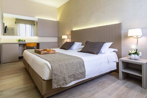 Hypo-allergenic bedding, down comforters, minibar, in-room safe